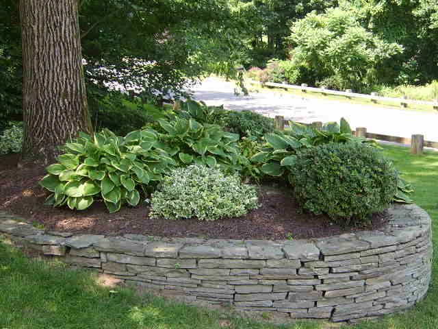 Softscaping with shrubs, mulch, and flowers